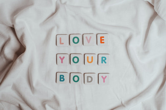 "Love Your Body" spelt out in scrabble tiles